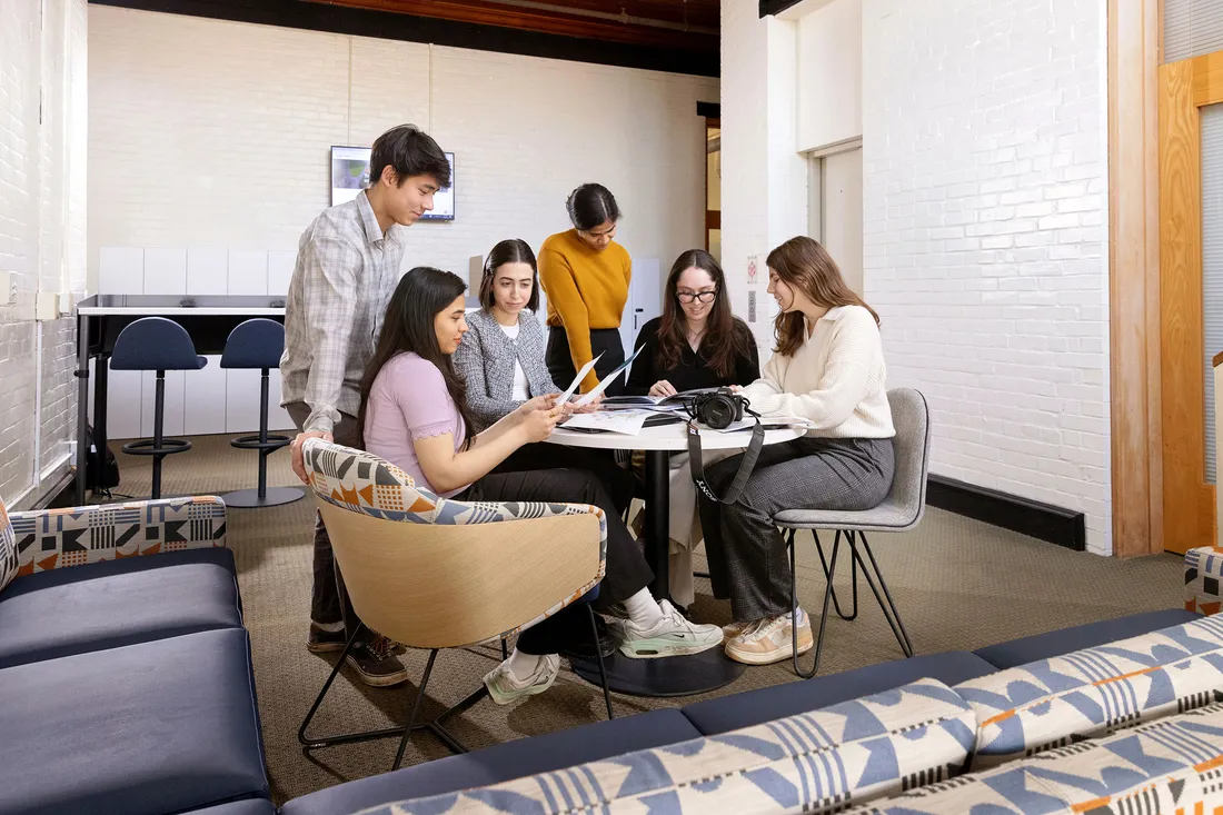 Students collaborating at a table.
